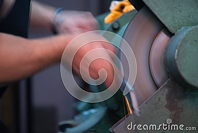 Blurred movement of blacksmith polishing Stock Photo