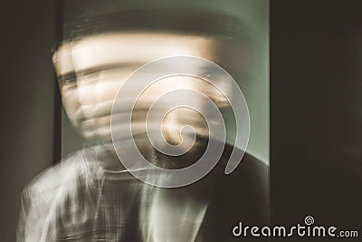 Blurred movement effect man in motion.Portrait of a guy Stock Photo