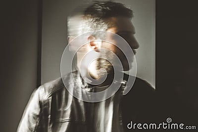 Blurred movement effect man in motion.Portrait of a guy Stock Photo