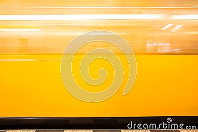 Blurred moving yellow train Stock Photo