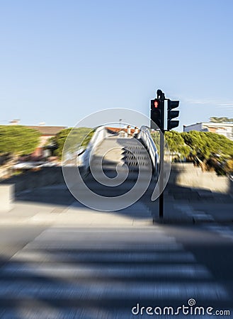 Blurred pedestrian crossroad with red semaphore Stock Photo