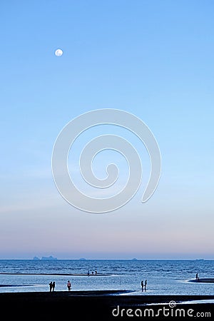 When the moon hits the blue sky with seascape in lately evening Stock Photo