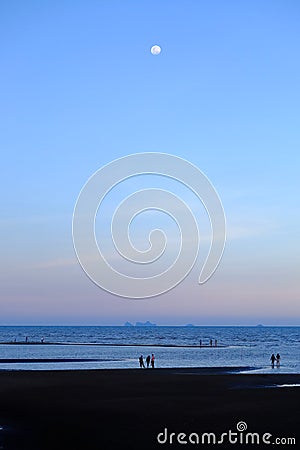 When the moon hits the blue sky with seascape in lately evening Stock Photo