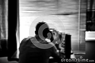 Blurred photo in soft focus. Special agent listens on the reel tape recorder. Officer wiretapping in headphones. KGB spying of Stock Photo