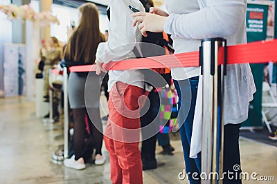 Blurred picture of Long Passenger Queue Waiting for Check-in at Airport Check-in Counters. Stock Photo