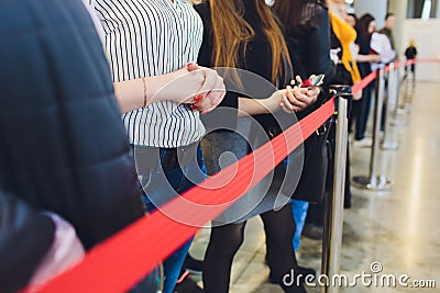 Blurred picture of Long Passenger Queue Waiting for Check-in at Airport Check-in Counters. Stock Photo