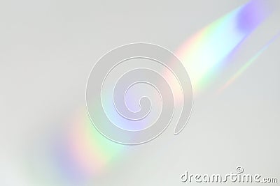 Blurred rainbow light refraction texture on white wall Stock Photo