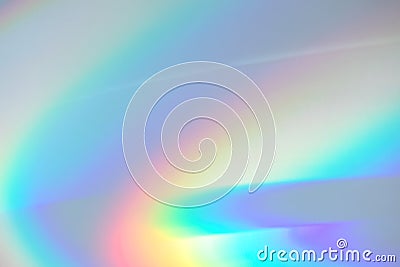 Blurred rainbow light refraction texture on white wall Stock Photo