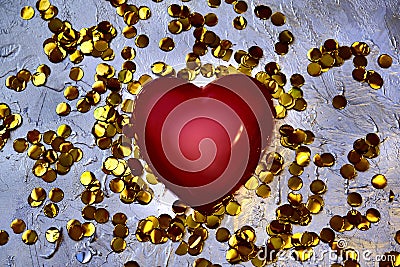 Blurred red heart and golden confetti, retro noise grain effect, tinted, holiday background Stock Photo