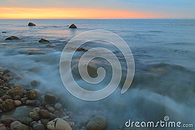 Blurred sea wave at dawn Stock Photo