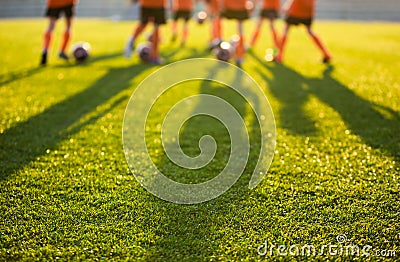 Blurred Soccer Field at School. Young Soccer Players Training Stock Photo