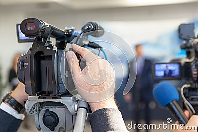 Blurred spokesman at press conference Stock Photo