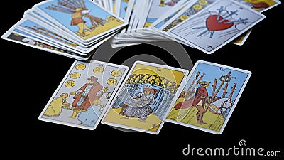 Blurred tarot cards in a card spread, isolated on Black Editorial Stock Photo