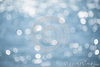 Blurred texture of shining sea surface with waves. Beautiful defocused background, sparkling, shimmering. Sea, ocean Stock Photo