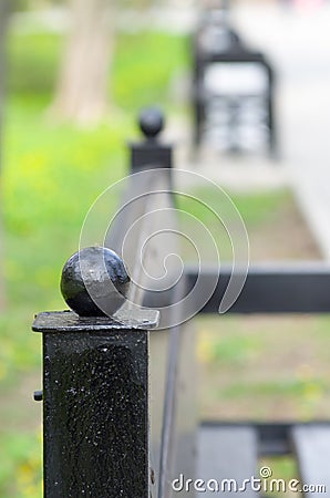 Blurred view of the alley in the park with benches Stock Photo