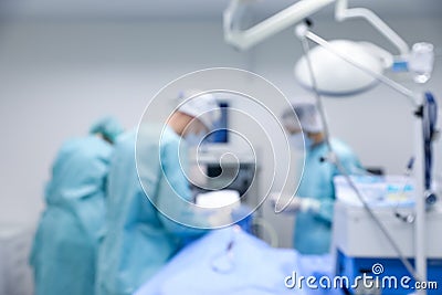 View of doctors operating patient in surgery room Stock Photo