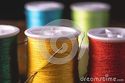 Blurred vivid colors threads bobbins spools, industrial sewing concept design Stock Photo