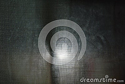 Blurring lamp behind mosquito net in night Stock Photo