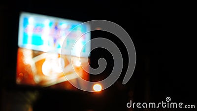 Blurry abstract neon sign in red, blue and white for advertisement in dark night Stock Photo