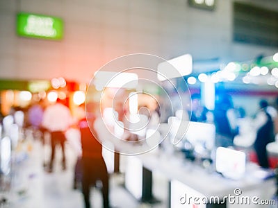 Blurry background of exhibition expo with crowd people in convention hall. Abstract concept. Business marketing and event theme. Stock Photo