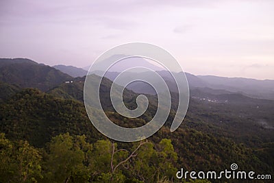 Blurry background of a morning view in the mountains. Landscape with fog. Natural backgrounds. Nature landscape scenery. Stock Photo
