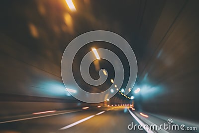 Blurry car tunnel with lights, motion blur background Stock Photo