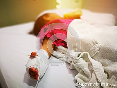 Blurry children are sick sleeping and use saline solution at the hospital, Climate change causes the flu. Stock Photo