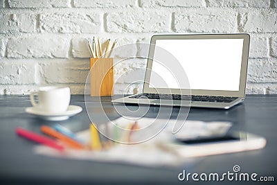 Blurry desk with white laptop Stock Photo