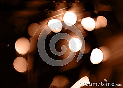 Blurry garland lights on a dark background. Festive Christmas and New Year background. Soft focus. Image toned in color Stock Photo