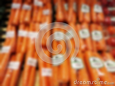 Blurry image of stack of fresh carrot packages Stock Photo