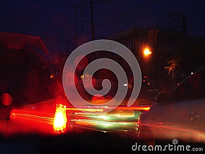 Blurry lights of cars on city streets at night, Transport - rush hour. Stock Photo