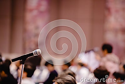 Blurry of microphone in auditorium and projector for shareholders ` meeting Stock Photo