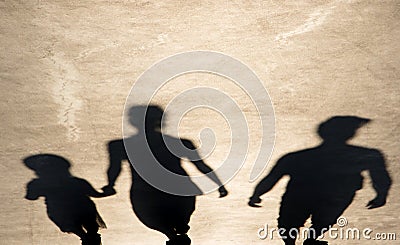 Blurry shadow of parents and daughter walking Stock Photo