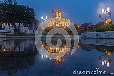 Blurry soft and flair Wat Ratchanatdaram Temple the beautiful golden castle or pagoda Bangkok, Thailand Stock Photo