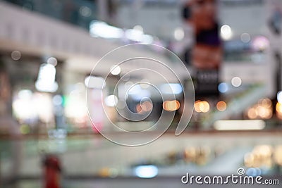 Blurry view of a bustling mall interior with various shops and boutiques, capturing the shopping atmosphere in a vibrant Stock Photo