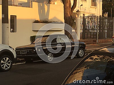 BMW 2002: convertible, coupe, E21, rear view of the car, black, parked on the street Editorial Stock Photo