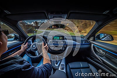 speeding in BMW 318 Diesel Touring M Package Interior Virtual cockpit Editorial Stock Photo