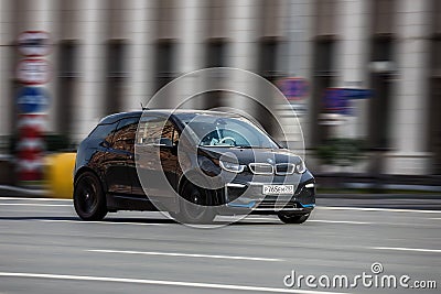 BMW i3 electric car drives down the street, front side view Editorial Stock Photo