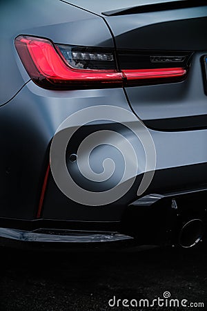 BMW M3 G80 led tail lights. Beautiful custom German luxury vehicle wrapped in black matte vinyl wrap on Drift Editorial Stock Photo