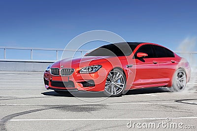 Kiev, Ukraine; June 25, 2013; BMW M6 and tire marks on the asphalt. The car stalled. Drift Editorial Stock Photo