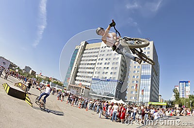 BMX cyclist performs a stunt jump Editorial Stock Photo