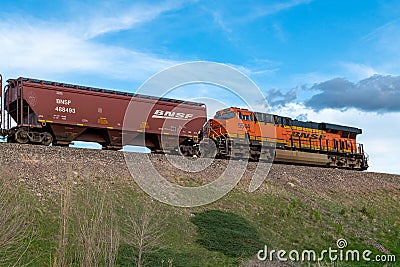 BNSF locomotive 5544 idling on bridge over W. Lincoln Highway while performing switching duties for a freight train in the Editorial Stock Photo