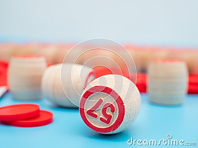Board game bingo. Wooden barrels with lotto numbers, playing cards for the game. Stock Photo