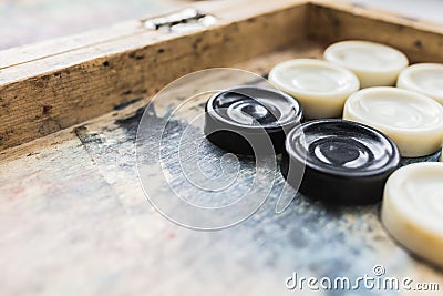 Board game checkers on a shabby board Stock Photo