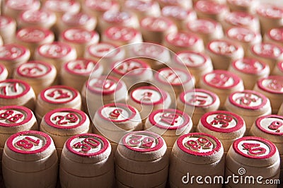 Board game lotto. Wooden lotto barrels for a game in lotto. Group intertainment, family leisure. Vintage game. Passion and luck. Stock Photo