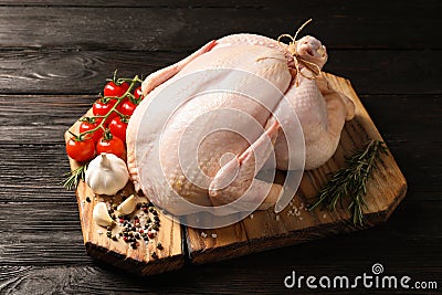 Board with raw turkey and ingredients Stock Photo