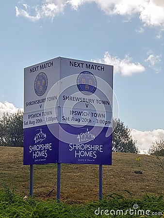 A board showing the next home match for Shrewsbury Town FC in Shrewsbury, Shropshire Editorial Stock Photo