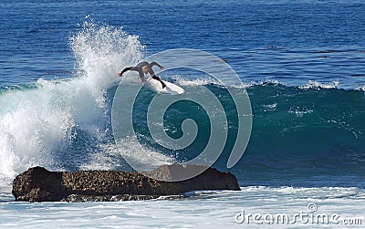 Board surfer riding in a wave at Laguna Beach, CA. Editorial Stock Photo