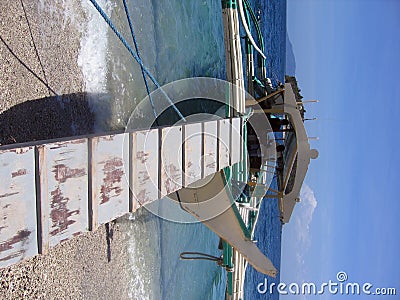 Boarding Banka Outrigger sabang beach Philippines Stock Photo