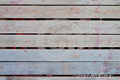 boards with gaps between themselves made of natural wood. wood texture. pale red drops on the boards Stock Photo